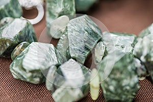 Macro shot of serpentine crystals in necklace. Natural, beautiful gemstones.