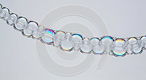 Chain of Iridescent Soap Bubbles