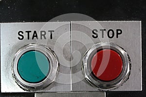 Macro shot of start and stop red and green mechanical buttons