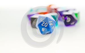 Macro shot of twenty sided dice with other dice