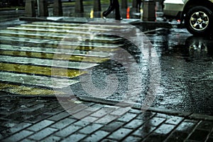 Macro shot of wet city street floor cobblestone during rain in europe