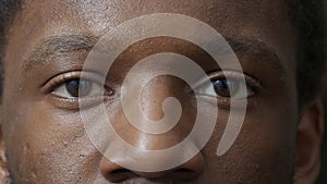 Macro shot of young adult blinking in front of camera