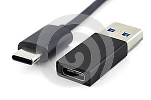 Macro shots of the USB 3.1 Type-C cable and adapter to USB 3.0 type A, isolated on a white background.