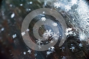 Macro snowflake close up on dark background