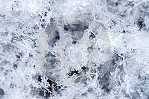 Macro of snowflake in natural surroundings.