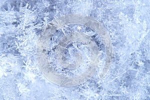 Macro of snowflake in natural surroundings.