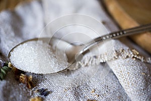 Macro still-life of tea spoon with white sugar