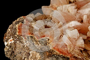 Macro of a stone Stilbite mineral on a black background