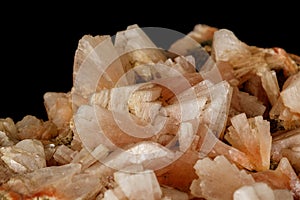 Macro of a stone Stilbite mineral on a black background