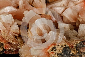 Macro of a stone Stilbite mineral on a black background