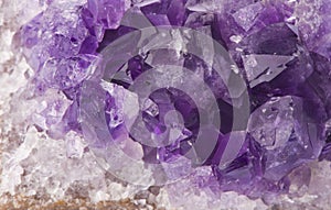 Macro structure of natural violet amethyst gem stone crystals texture