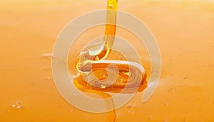 Macro of thick fresh honey dripping