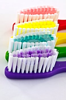 Macro of bright colorful toothbrushes