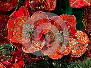 Macro of two red flowers on christmas tree