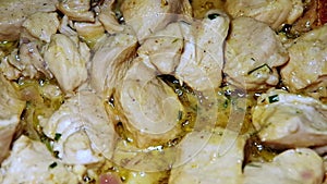 Macro view of chicken fillets boil and gurgle