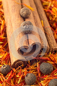 Macro view of the cinnamone, peppercorn and saffron photo