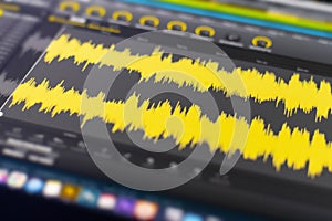 a macro view of the computer monitor screen with sound audio wave graph volume