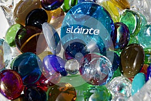 Macro view of a crystal glass bowl containing decorative glass stones