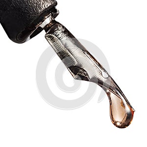 Macro view of drop liquid on tip of pen