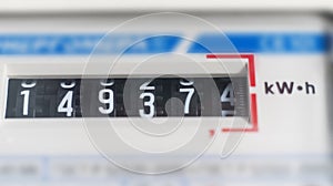 a macro view of electricity watt meter, kilowatt calculator counter at home, savings economy