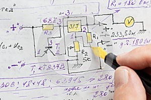 macro view of engineer planing the electrical circuit on papers