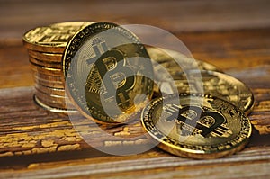 Macro view of gold and silver color shiny coins with Bitcoin symbol