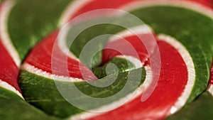 Macro view of green and red Christmas style lollipop candy photo