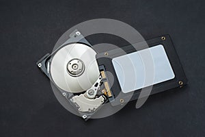 Macro view of an HDD head resting on a disk platter and its reflection