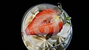 Macro view on mousse creamy dessert with sliced strawberry