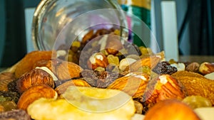 Macro view of the nuts, seeds and dried fruits in a glass jar