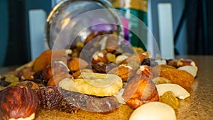 Macro view of the nuts, seeds and dried fruits in a glass jar