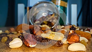Macro view of the nuts, seeds and dried fruits in a glass jar