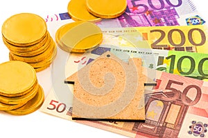 Macro view of paper euro money and gold coins