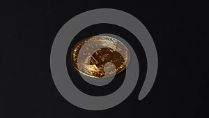 macro view rising over gold and silver cryptocurrency coin on black background, 4k blockchain altcoin investment