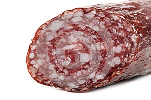 Macro view of Salami smoked sausage stick isolated