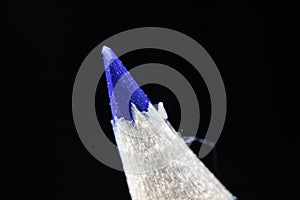 Macro view of the tip of the pencil on a black background
