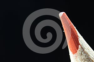 Macro view of the tip of the pencil on a black background