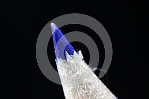 Macro view of the tip of the pencil on a black background