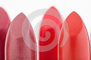 Macro view of two red lipstick heads