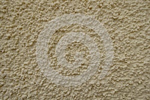 Macro of wall with light beige roughcast finish photo
