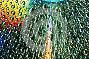 Macro of water drops on multicolor background