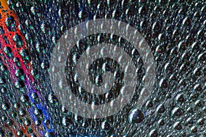 Macro of water drops on multicolor background