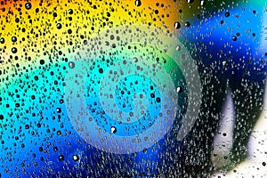 Macro of water drops on multicolor background