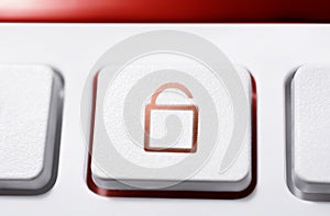 Macro Of A White Button With Red Opened Security Lock Icon