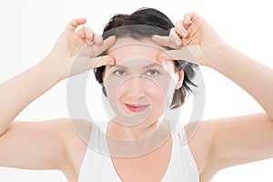 Macro Woman face with wrinkles on the forehead. Collagen and face injections concept. Menopause. Cropped image. Copy space