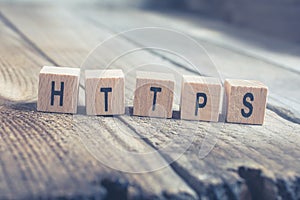 Macro Of The Word HTTPS Formed By Wooden Blocks On A Wooden Floor