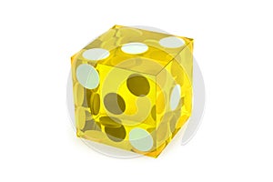 Macro yellow dice isolated on white / result as three on top with a light shadow