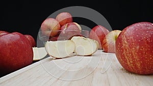 Macrography of apple display in various forms with black background. Comestible.