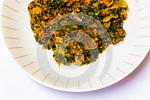 Macrophotography, close up of Efo riro shared in a dish