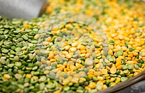 Macroshot of green and yellow mixed lentils, sale on local city